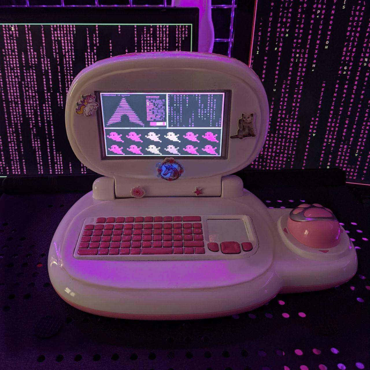 PinkPad in front of screens